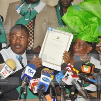 Moses Wetang’ula displays the party’s certificate of compliance at the Registrar of Political Parties’ office