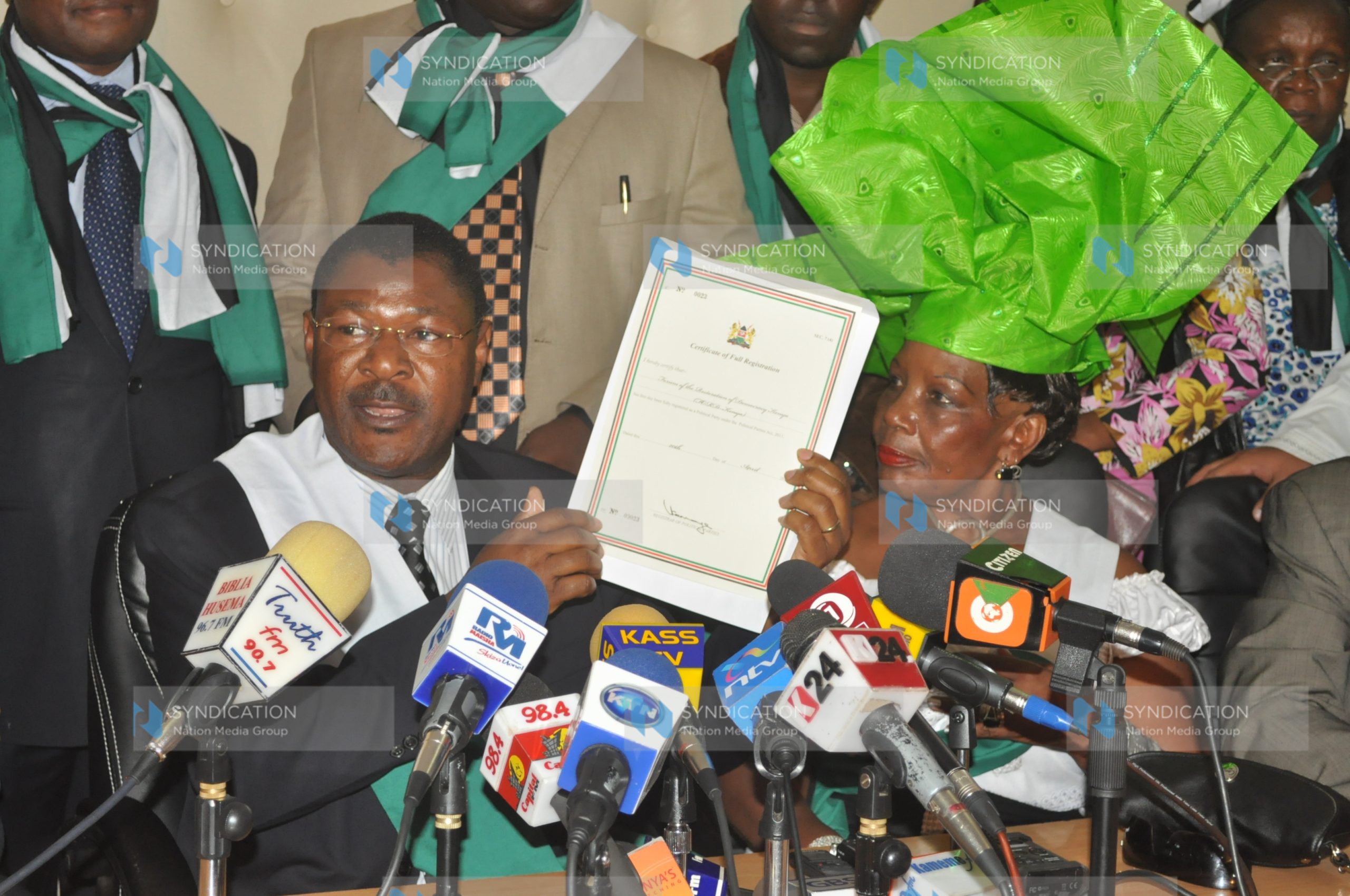 Moses Wetang’ula displays the party’s certificate of compliance at the Registrar of Political Parties’ office