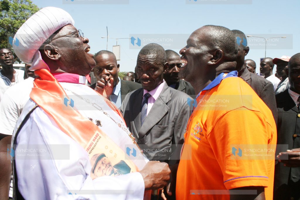 Holy Ghost Coptic Church of Africa head Father John Pesa 1 talks to a member of ODM party