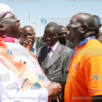 Holy Ghost Coptic Church of Africa head Father John Pesa 1 talks to a member of ODM party