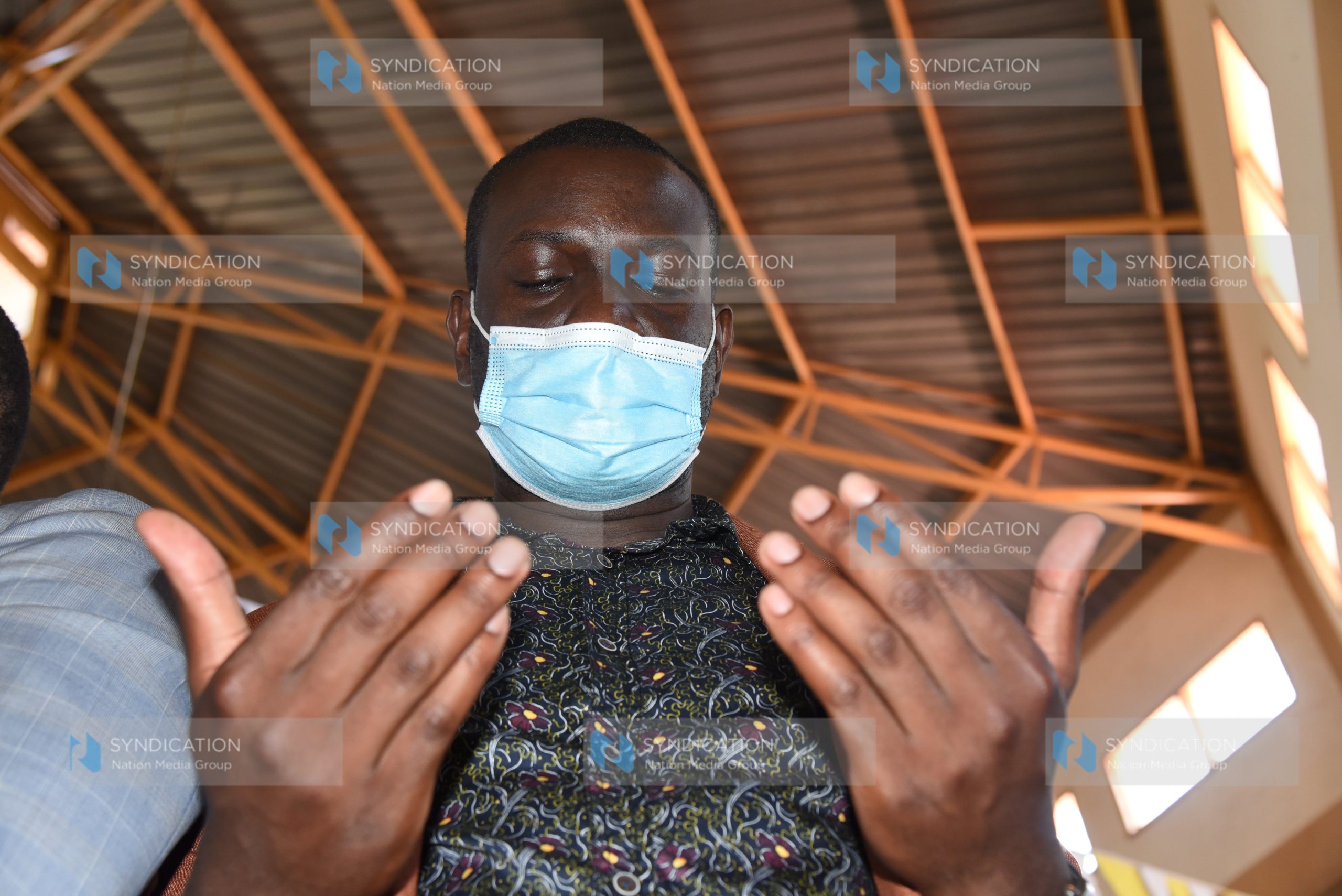 ODM Secretary General Edwin Sifuna praying at Soweto Catholic Church
