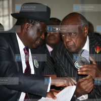 Prime Minister Raila Odinga chats with former Attorney General Charles Njonjo (right)