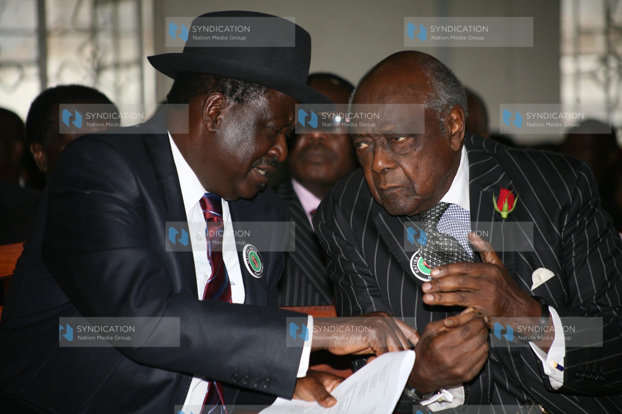 Prime Minister Raila Odinga chats with former Attorney General Charles Njonjo (right)