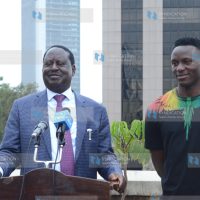 Raila Odinga (left) and Harambee Stars Captain Victor Wanyama address the media at Capitol Hill offices