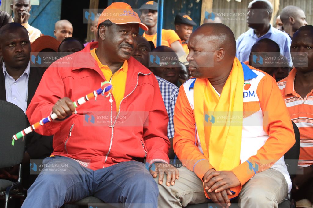 Cord Raila Odinga (Center) shares a word with ODM candidate in the Nyacheki ward by election