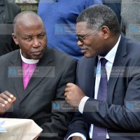 Peter Karanja, Secretary General of the NCCK, confers with Catholic Bishop Alfred Rotic