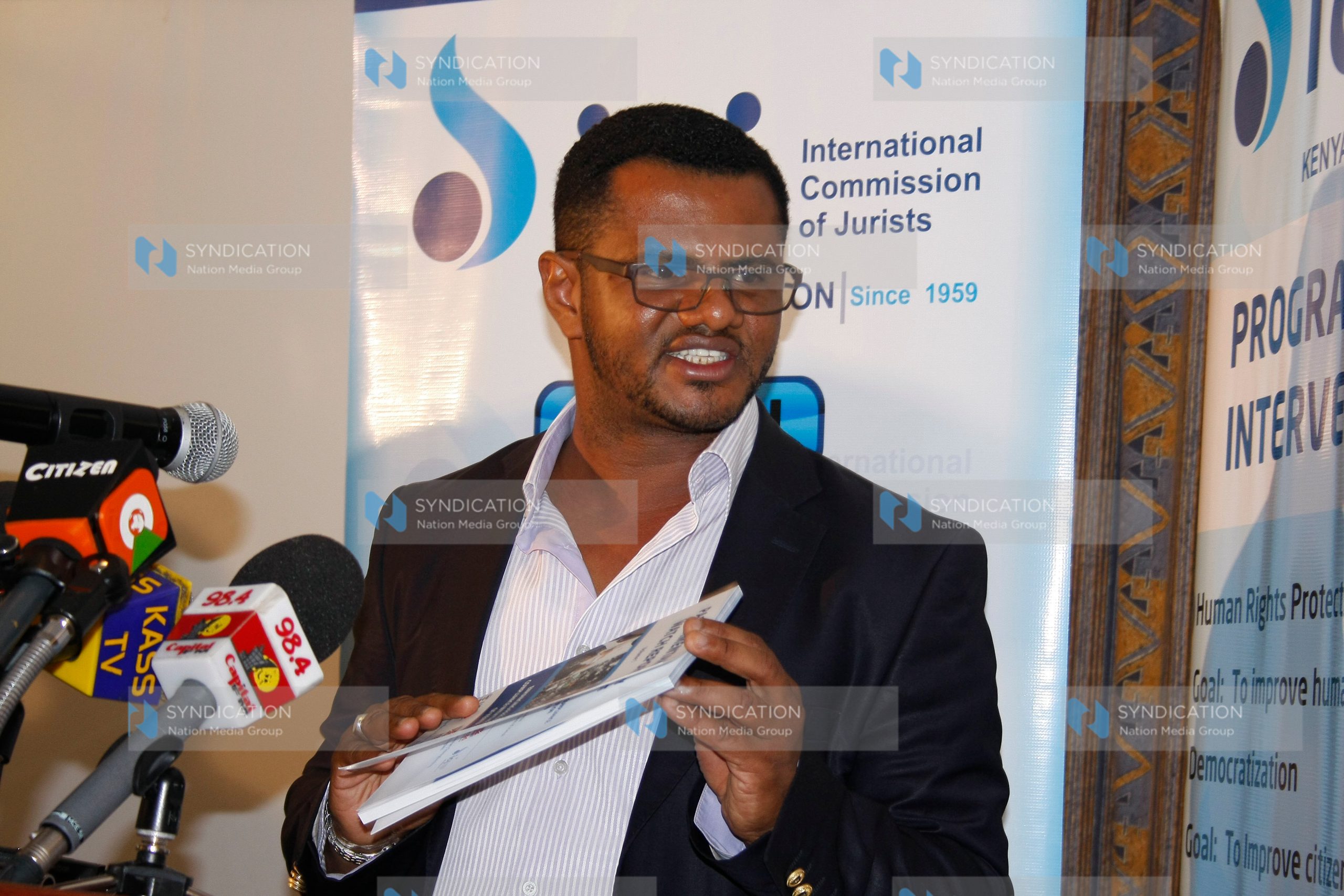 Mombasa Senator Hassan Omar,with a copy of parliamentary watch report