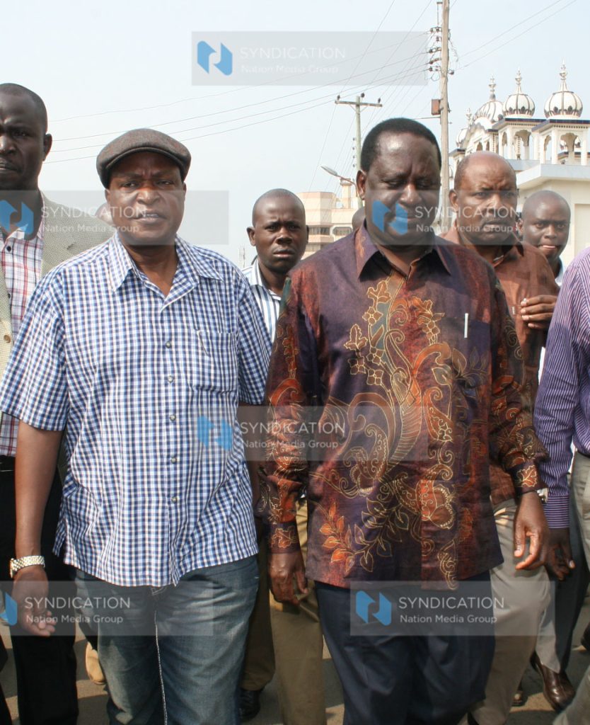 Former Prime Minister Raila Odinga (centre) leaves a Sikh temple