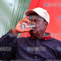 Raila Odinga sips some water during a media briefing