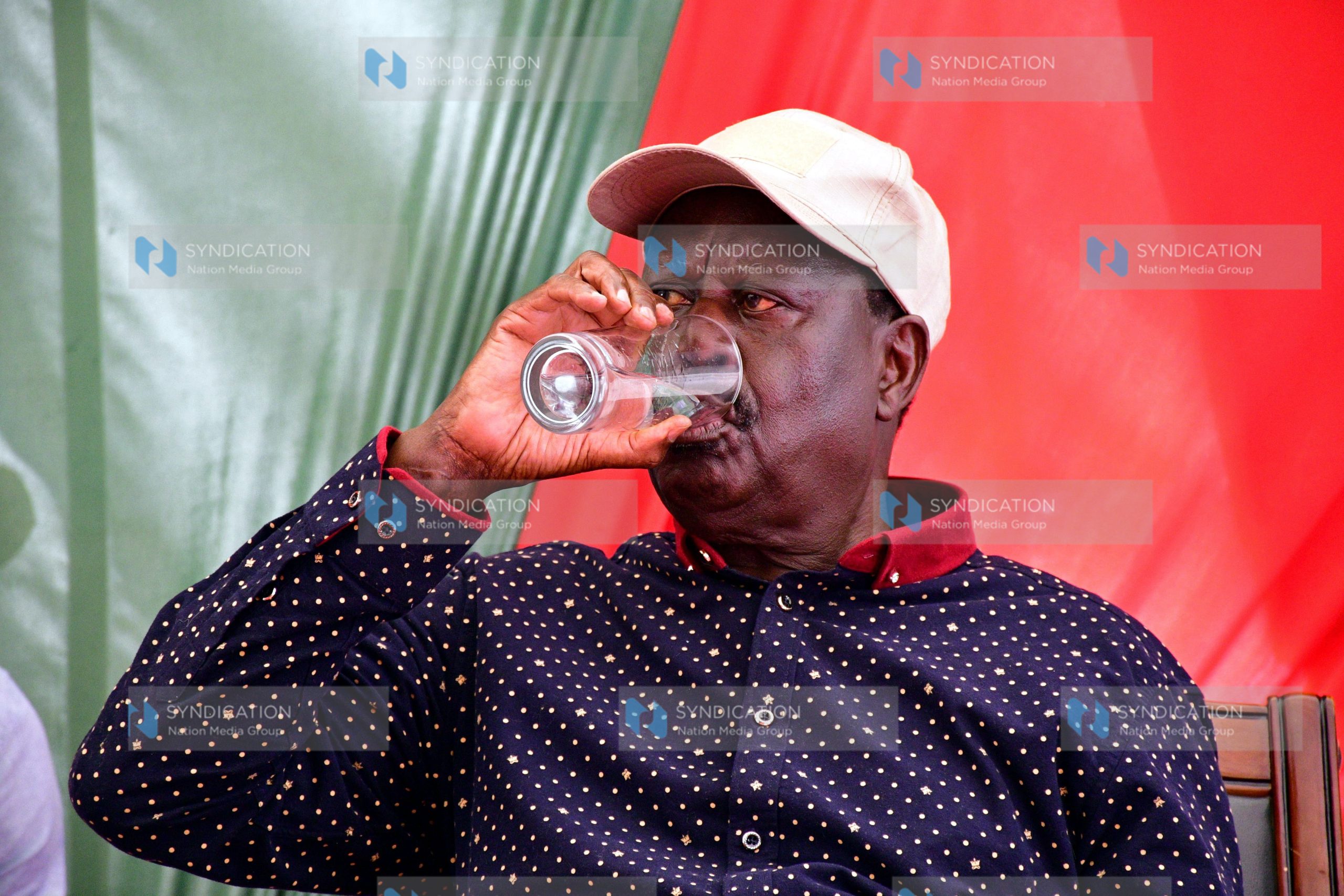 Raila Odinga sips some water during a media briefing