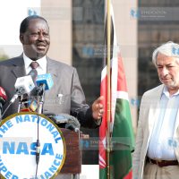 Raila Odinga, with his adviser Salim Lone (right)
