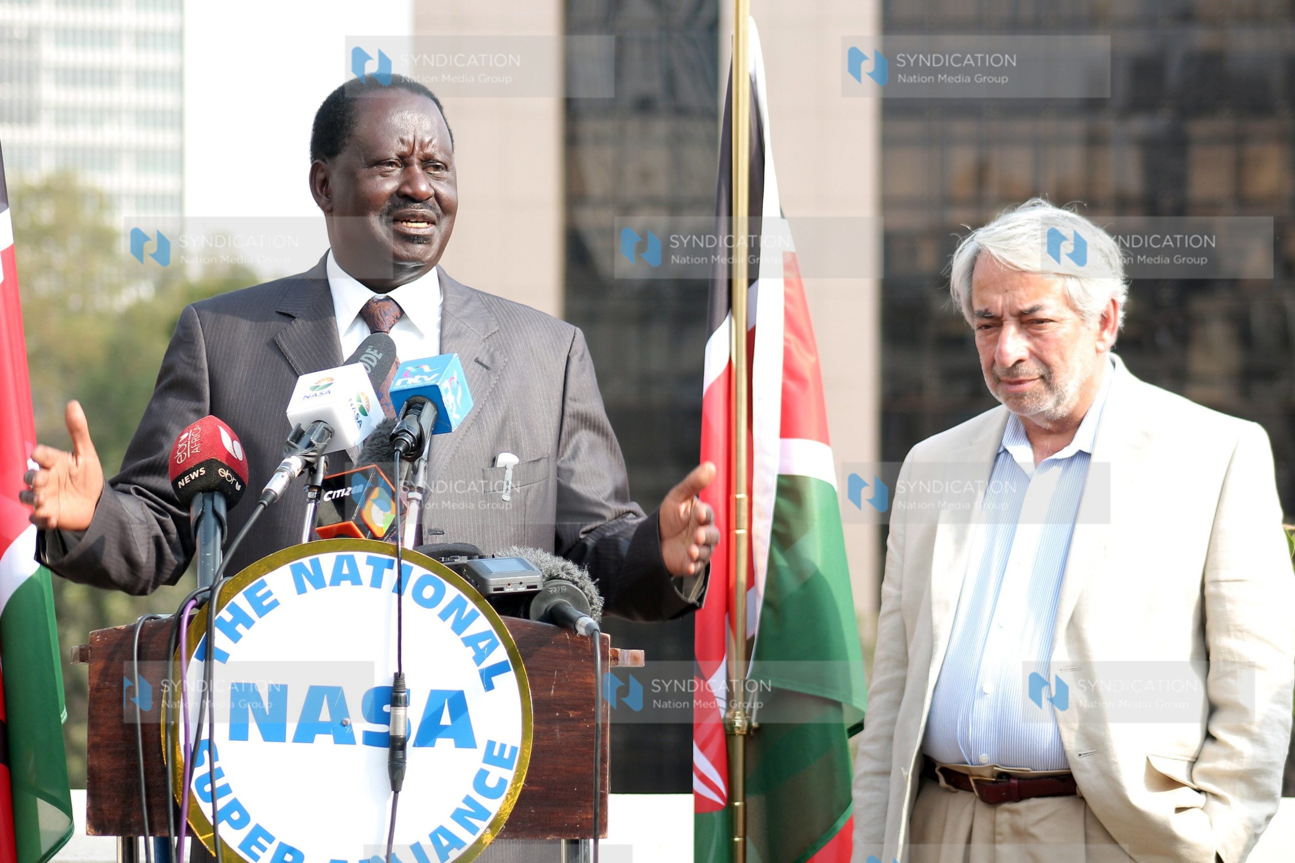 Raila Odinga, with his adviser Salim Lone (right)