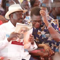 ODM leader Raila Odinga chats with Ugunja MP Opiyo Wandayi