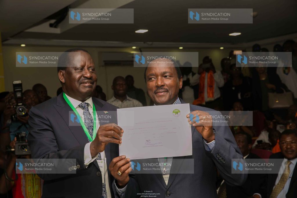 Raila Odinga with his running mate Kalonzo Musyoka displays certificate