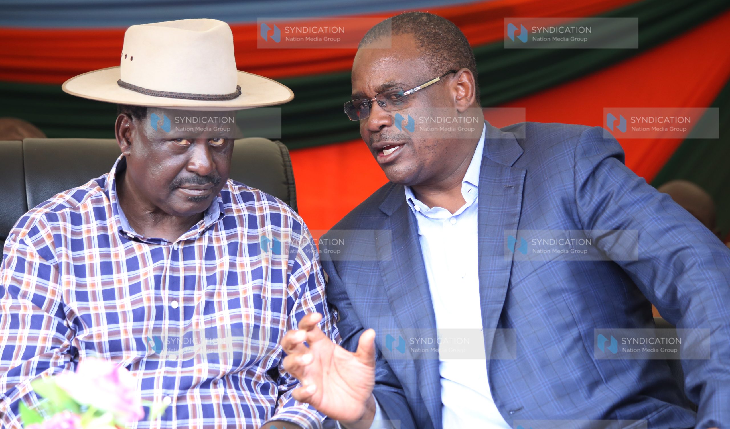 CORD leader Raila Odinga (left) chats with Nairobi Governor Evans Kidero