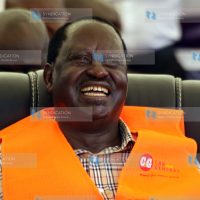 Raila Odinga laughs as he follows proceedings during a meeting with bodaboda riders