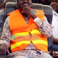 CORD leader Raila Odinga laughs as he follows proceedings
