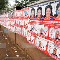 Campaign posters plastered across the perimeter wall of Moi Avenue Primary School