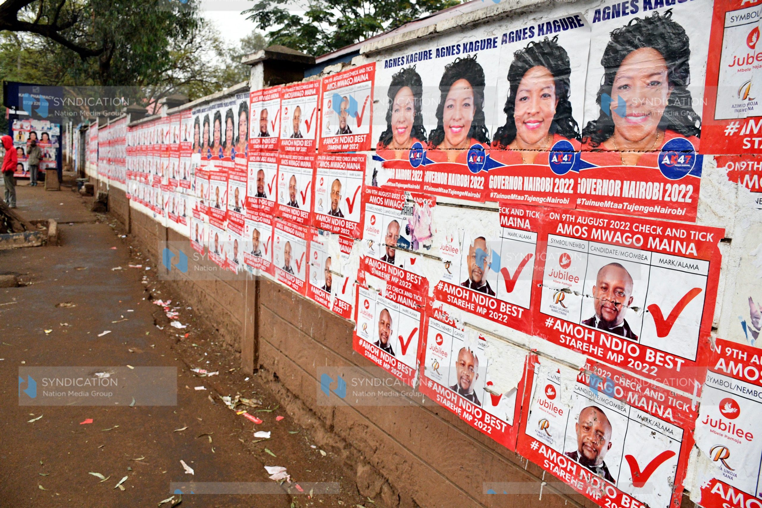 Campaign posters plastered across the perimeter wall of Moi Avenue Primary School