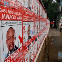 Campaign posters plastered across the perimeter wall of Moi Avenue Primary School