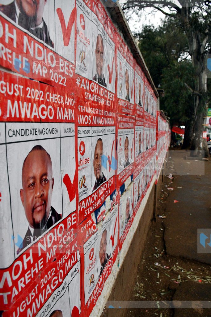 Campaign posters plastered across the perimeter wall of Moi Avenue Primary School
