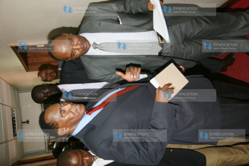 Minister for Internal Security Prof George Saitoti with the Permanent Secretary Francis Kimemia