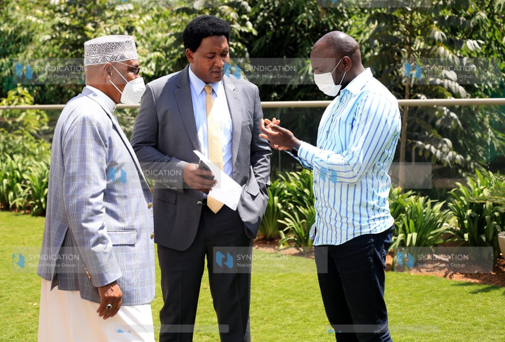 Elgeyo Marakwet Senator Kipchumba Murkomen chats with Narok Senator Ledama Ole Kina and Mandera Senator Mohamed Mohamud
