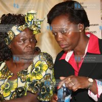 Nobel Peace Prize laureate Professor Wangari Maathai, confers with former Justice Assistant Martha Karua Cheptumo