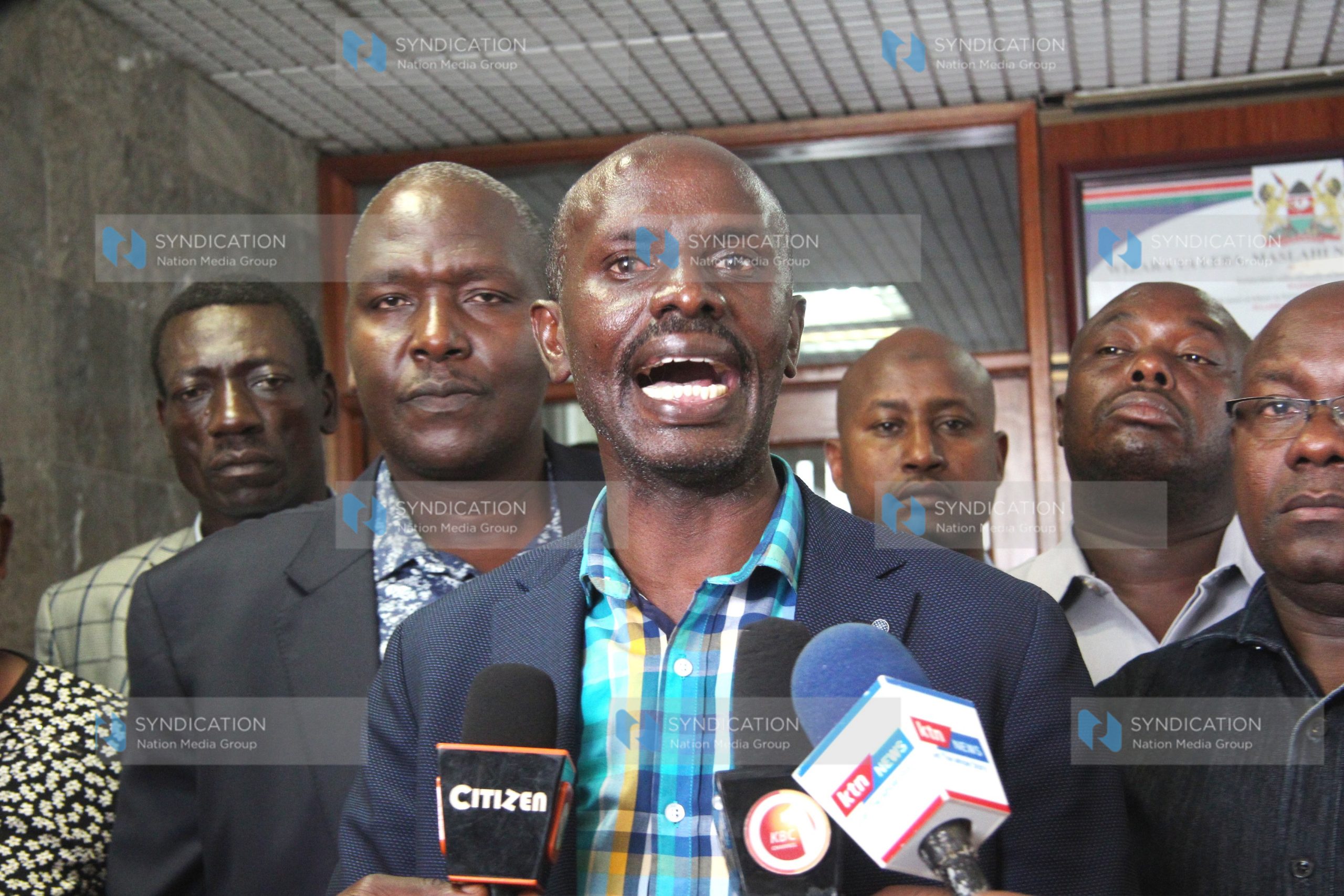 Kenya National Union of Teachers Secretary General Wilson Sossion accompanied by other union members
