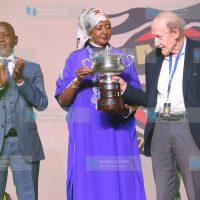 FIA Founding Member's club heritage cup winner Robert "'Bob'' Diwar 'receive his award from Sports CS Amina Mohamed and KMSF Chairman Phineas Kimathi