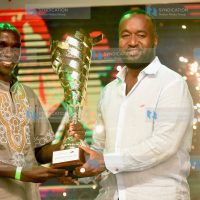 Mombasa Governor Hassan Joho hands over Sportsman of the Year trophy to World Marathon Holder Eliud Kipchoge