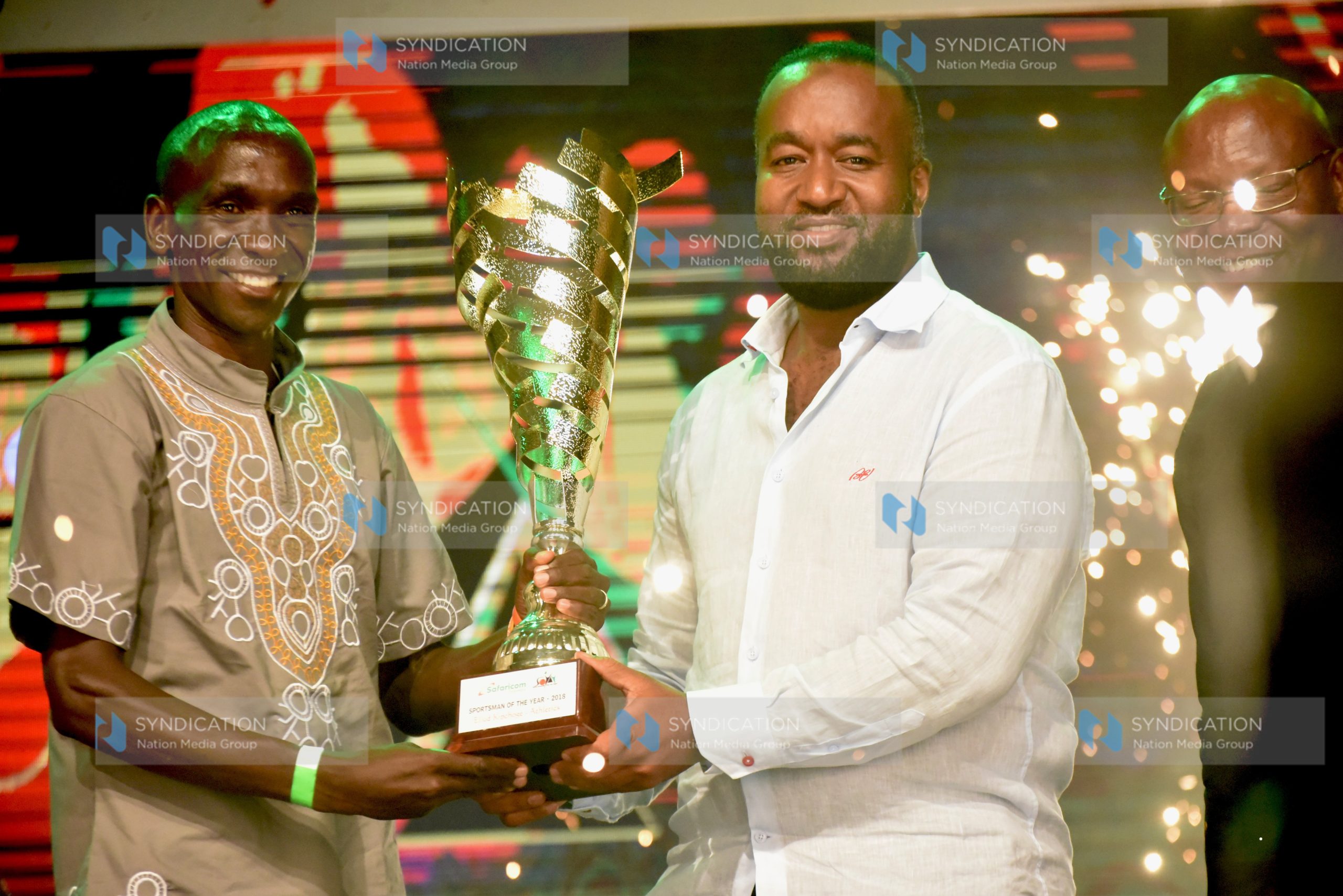 Mombasa Governor Hassan Joho hands over Sportsman of the Year trophy to World Marathon Holder Eliud Kipchoge