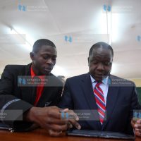 Cabinet Secretary for Information, Communication and Technology Dr Fred Matiang’i with Starehe boys centre student Hassan Masha
