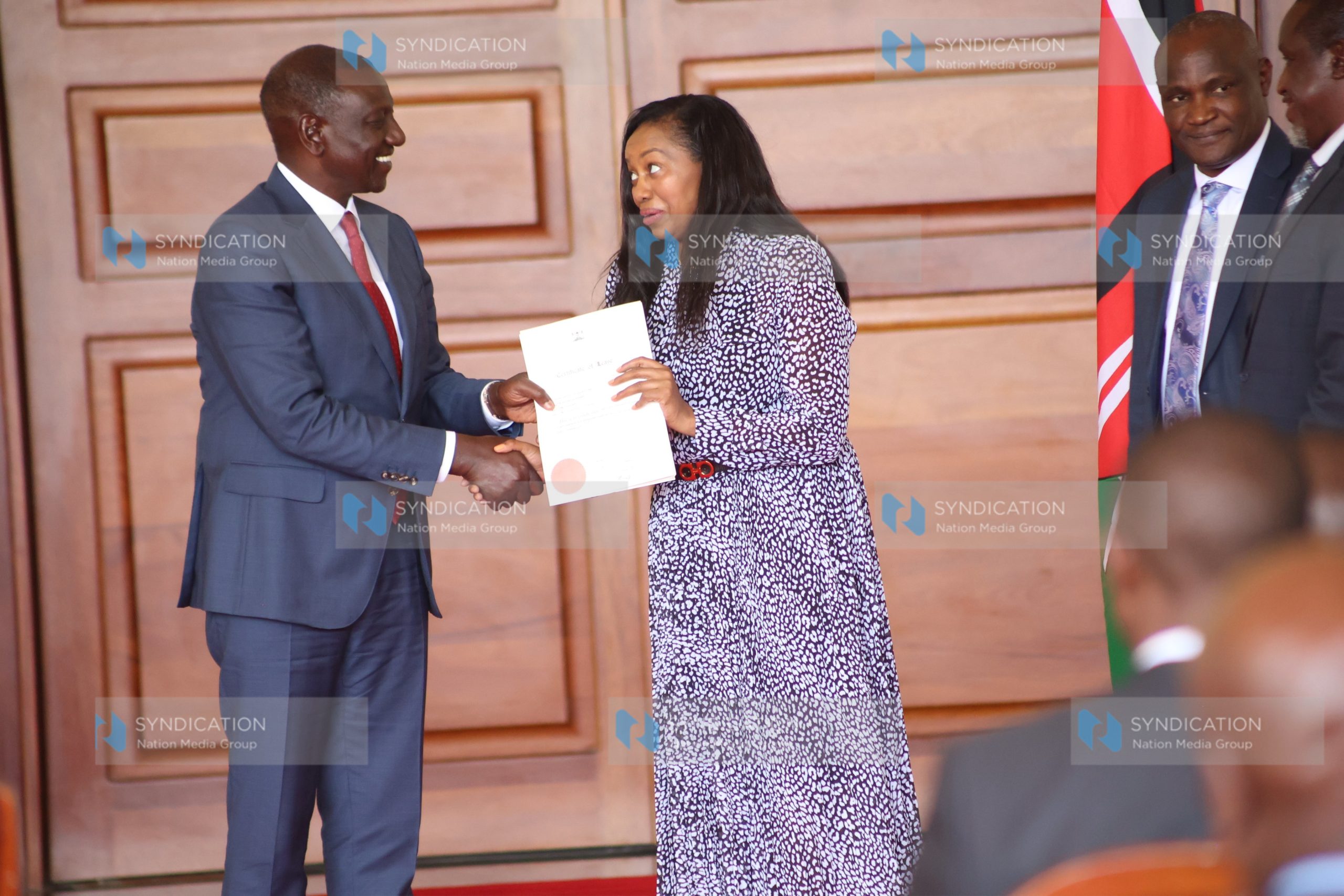 President William Ruto handing over title deed to Nakuru Governor Susan Kihika