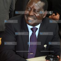 Former Prime Minister Raila Odinga enjoys a cup of coffee and chats with students
