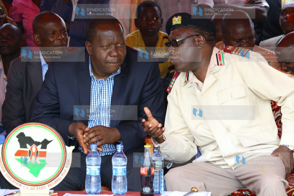 Interior acting Cabinet secretary Dr. Fred Matiang’i consults with Nyanza regional coordinator Wilson Njega