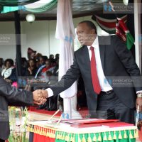 Karanja Kibicho with President Uhuru Kenyatta during the swearing-of Principal Secretaries