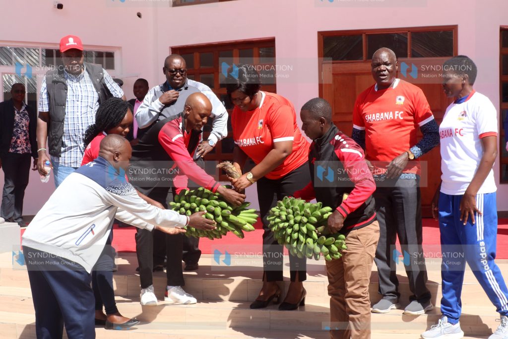 Homa Bay Governor Gladys Wanga receives a gift from players from Shabana Football Club