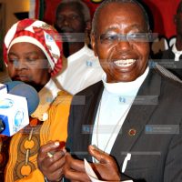 Human rights activist Dr Timothy Njoya flanked by National Civil Society Congress