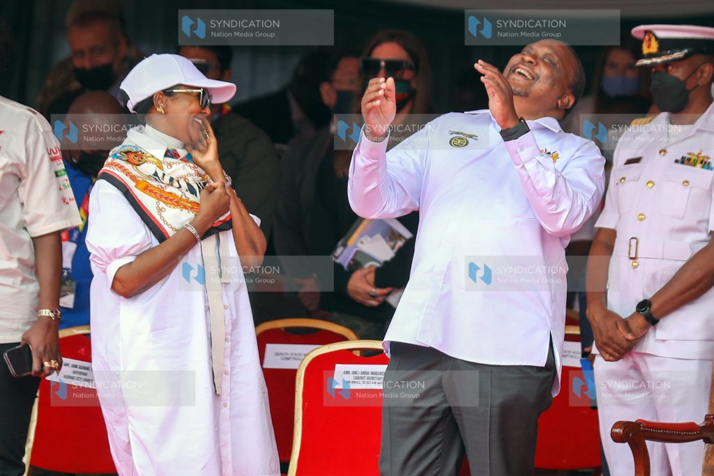 President Uhuru Kenyatta shares a light moment with Sports Cabinet Secretary Amina Mohamed