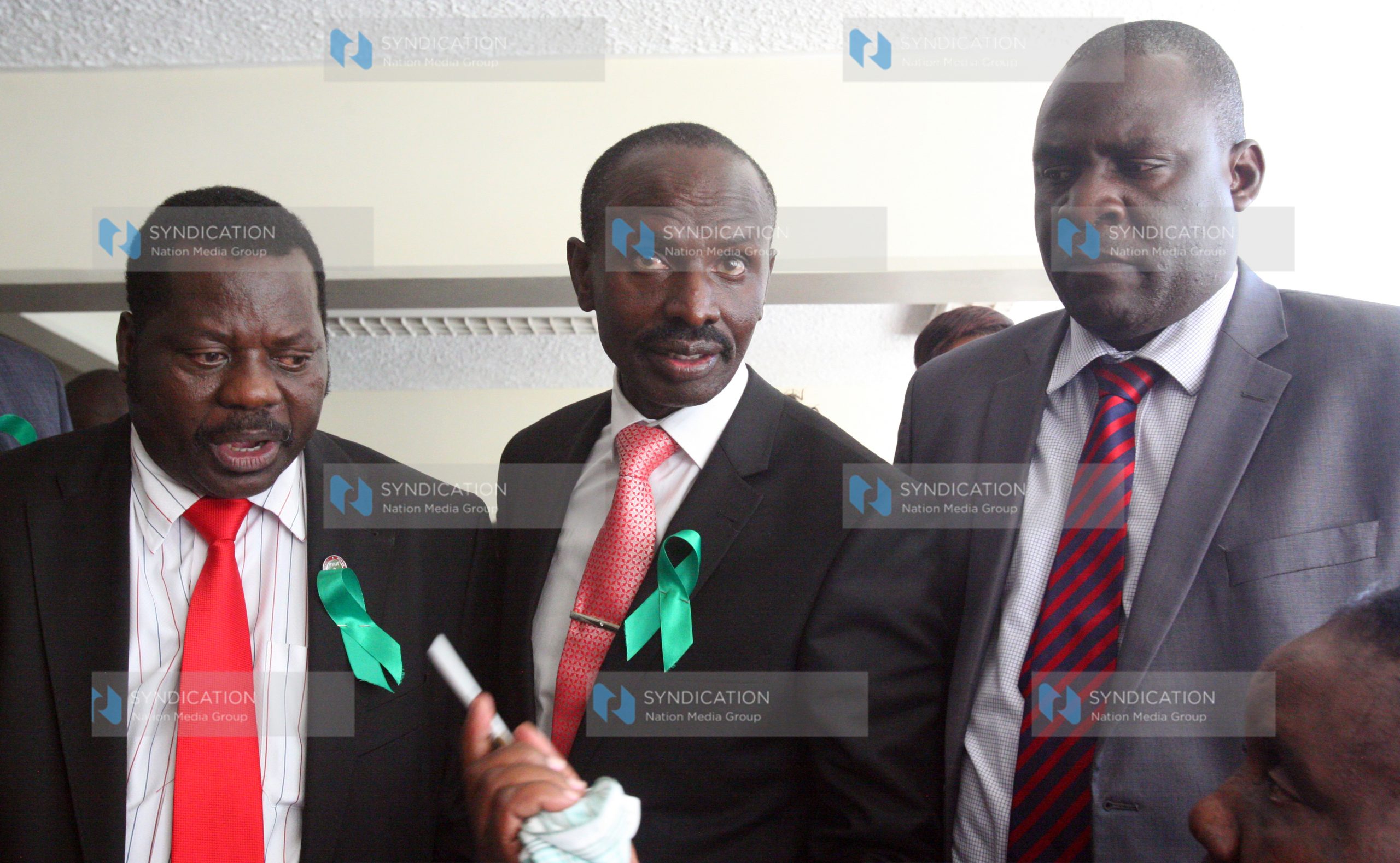 KNUT National Chairman Mudzo Nzili, KNUT Secretary General Wilson Sossion and Kenya Union of Post Primary Education Teachers Chairman Omboko Milemba