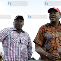 Uhuru Kenyatta and his deputy William Ruto speak in Githunguri during a TNA rally