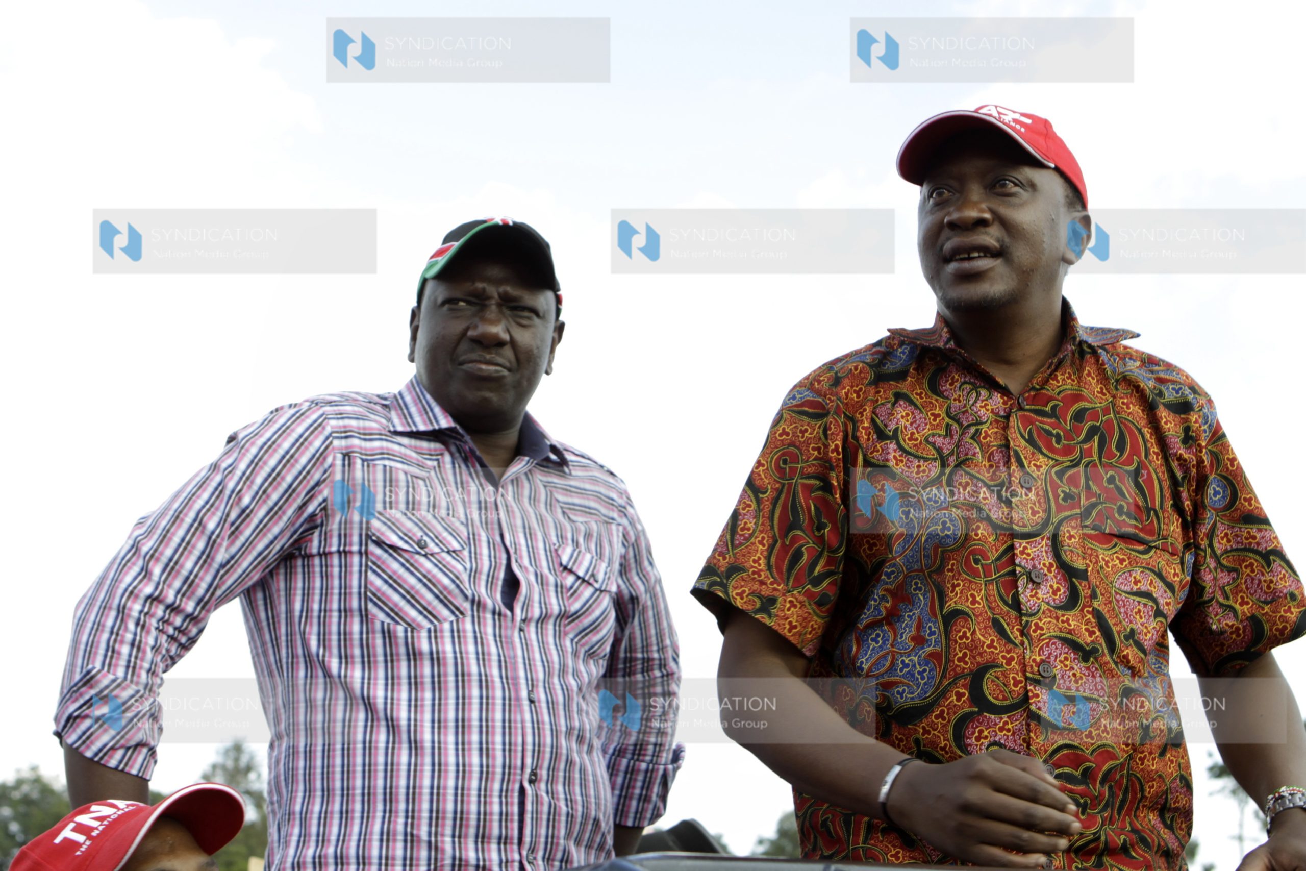 Uhuru Kenyatta and his deputy William Ruto speak in Githunguri during a TNA rally
