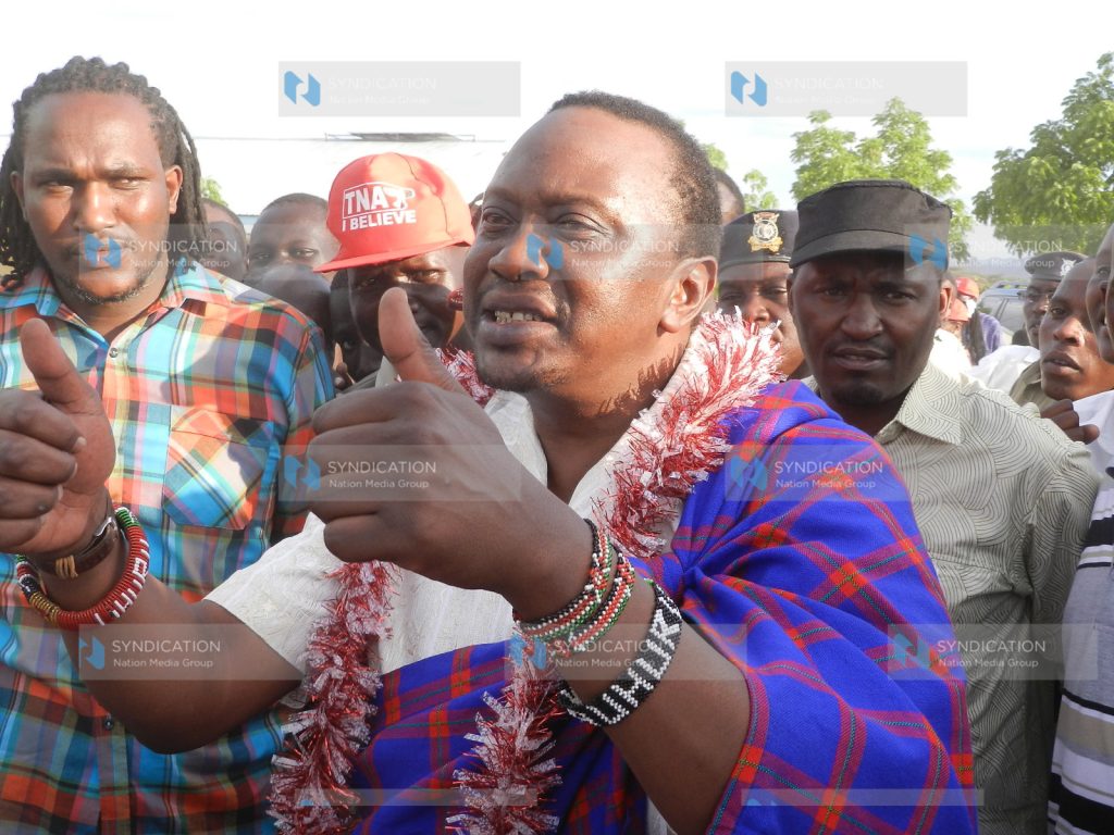 Deputy Prime Minister Uhuru Kenyatta joins traditional dancers in Lokichar, Turkana South District