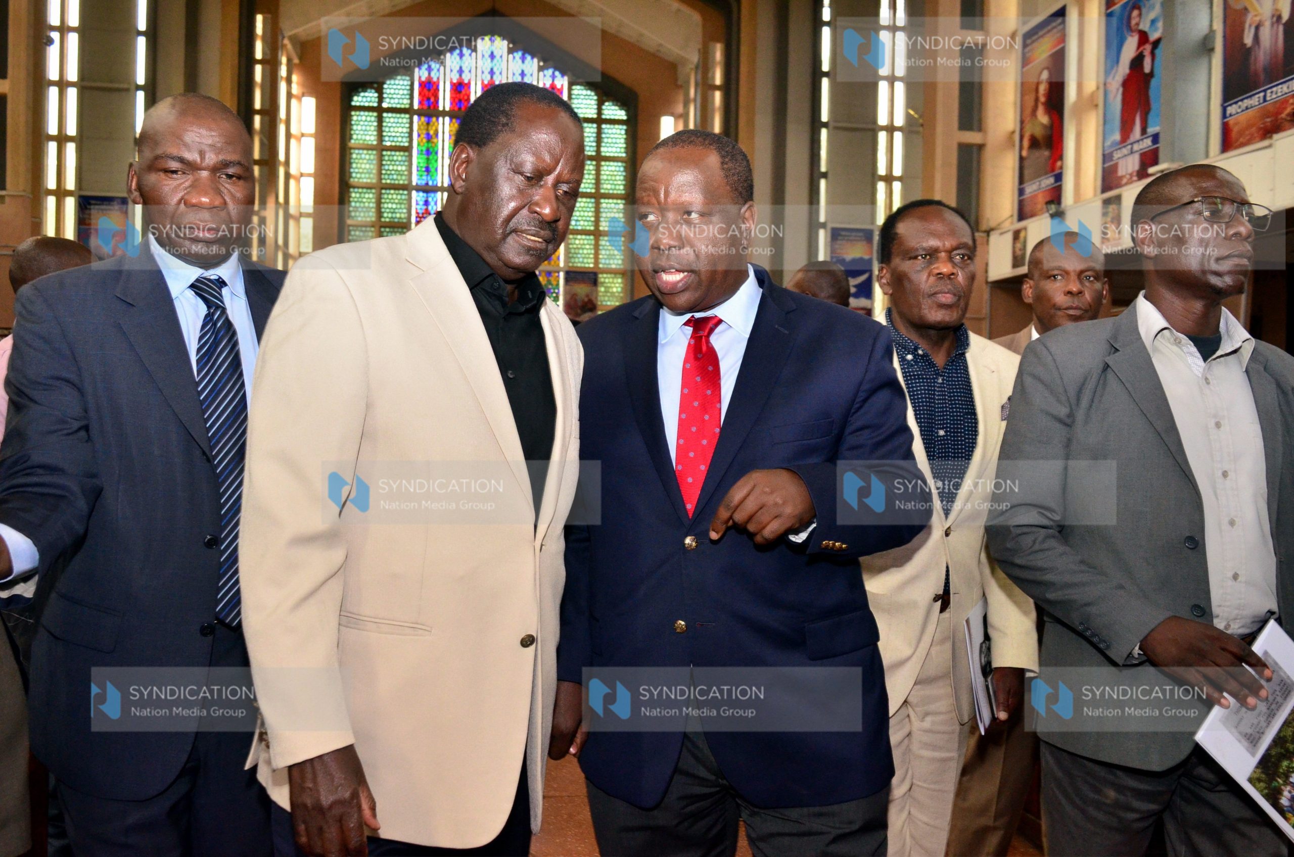 Interior Cabinet Secretary Fred Matiang’i walks with former Prime Minister Raila Odinga