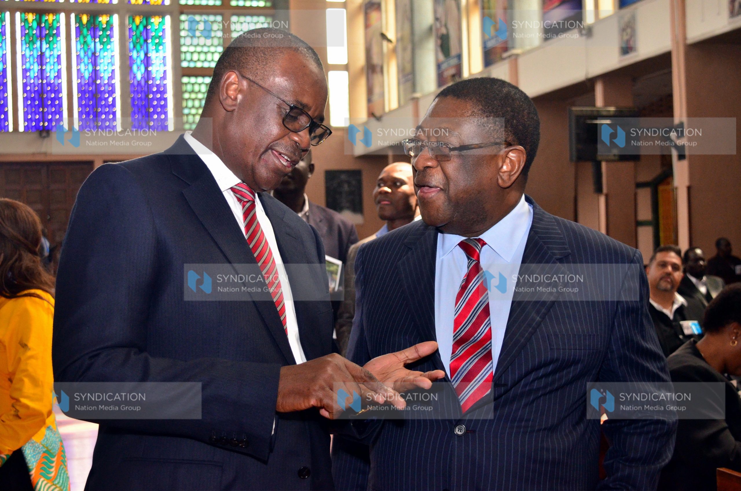 Former Nairobi Governor Evans Kidero confers with former Attorney General Amos Wako