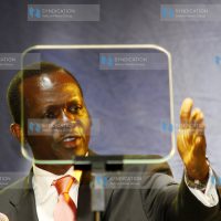 Raphael Tuju reads from the auto-Q during the launching of Party of Action at Kenyatta International Conference