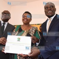 UDA Secretary General Veronica Maina handing over Certificate of nomination to Nairobi Gubernatorial candidate Johnson Sakaja and his running mate James Njoroge Muchiri