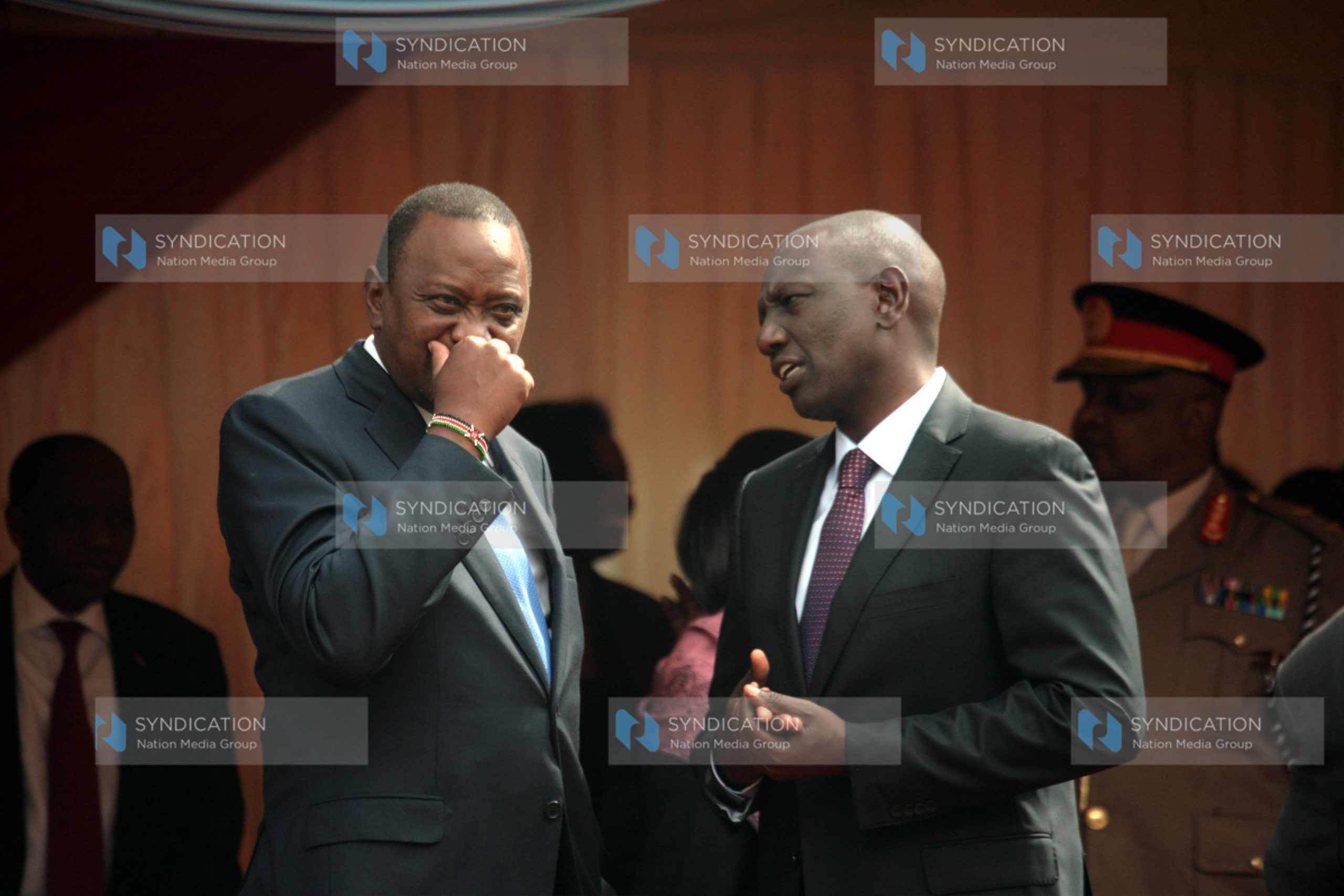 President Uhuru Kenyatta chats with Deputy President Willam Ruto
