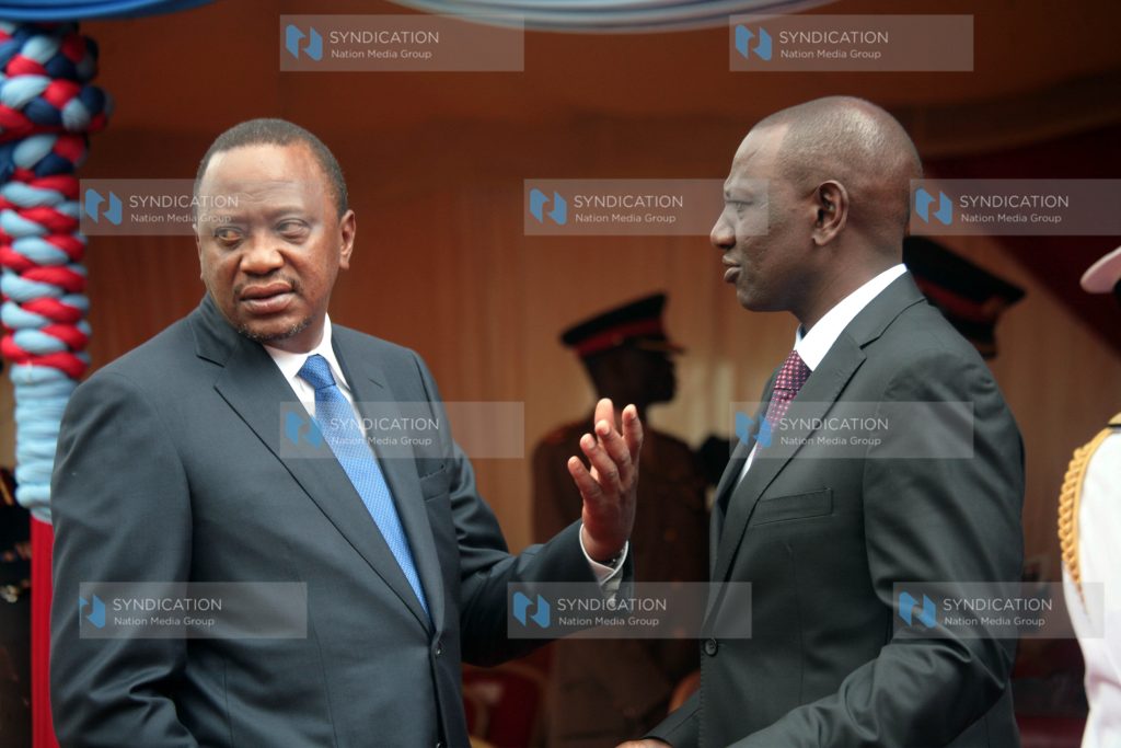 President Uhuru Kenyatta chats with Deputy President Willam Ruto